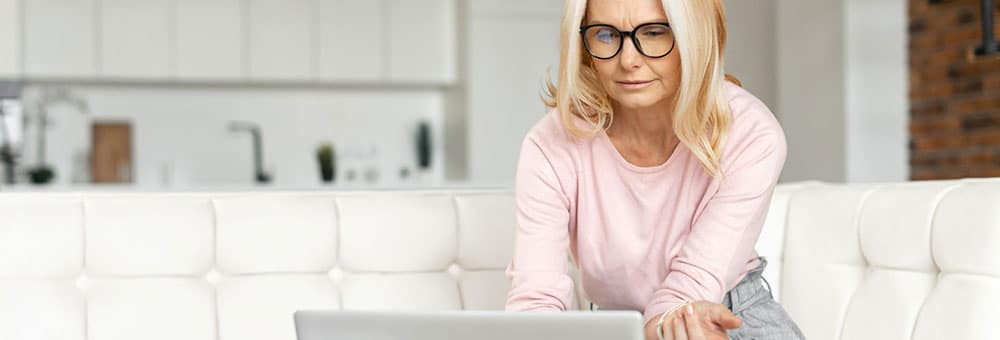 older woman searching on computer