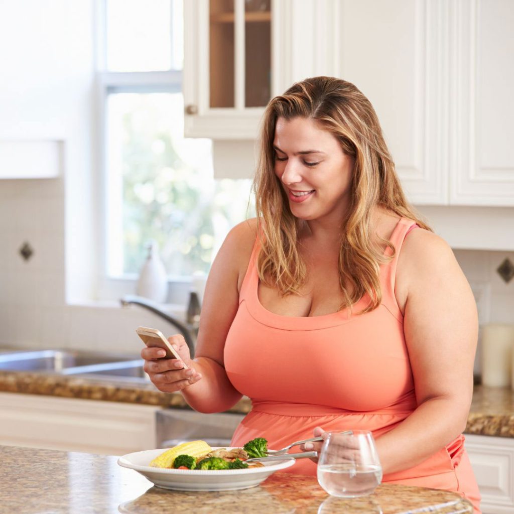 Woman eating vegetables